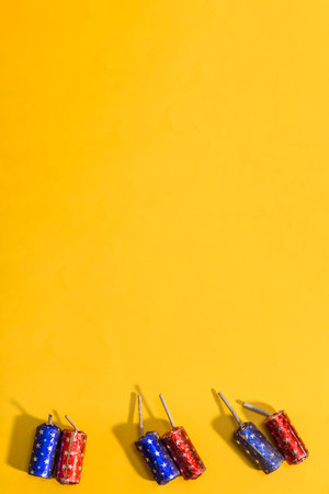Diwali festival Indian traditional firecracker bomb on yellow background. Happy Diwali.