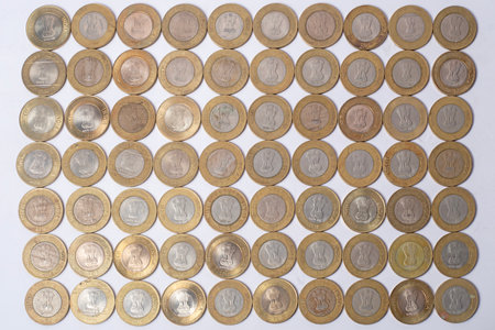 Top view of various Indian ten rupee coins obverse coin texture background