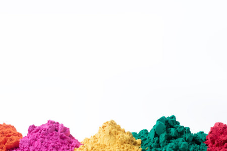 Colorful holi powder isolated on white background with copy space. Indian festival Holi backgroundの写真素材