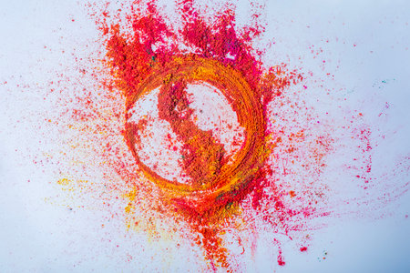 Multicolored holi powder in the form of a circle on a white background. Holi festival concept.の写真素材