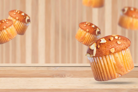 Almond muffins on a wooden table with a blurred background. Copy spaceの写真素材