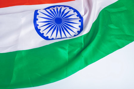 Indian flag waving in the wind isolated on white background with space for text.