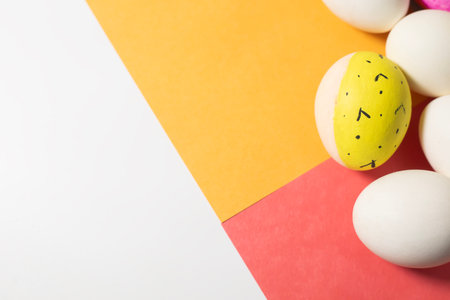 Happy Easter concept. Colorful easter eggs on colorful background with copy space for text.の写真素材