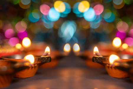 Glowing clay lanterns during Indian festival Diwali celebrations with bokeh effect background with copy space. Selective focusの写真素材