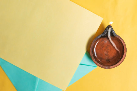 Festive Diwali greeting card with traditional clay lamps. Celebrate the festival of light with good wishes.の写真素材