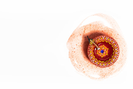 Diwali Diya over brush strokes on white background. Hindu festival of lights.の写真素材