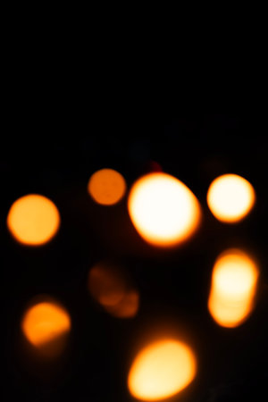 Abstract blurred warm bokeh lights on a dark background. bokeh effect, overlay