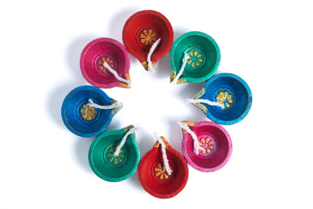 Colorful decorative diyas arranged in circular pattern for diwali Celebrationの写真素材