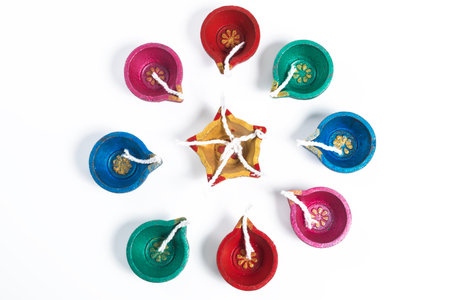 Colorful decorative diyas arranged in circular pattern for diwali Celebrationの写真素材