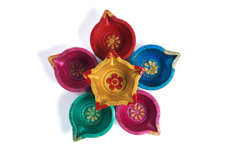 Colorful traditional Diwali Diyas on white background. Top viewの写真素材