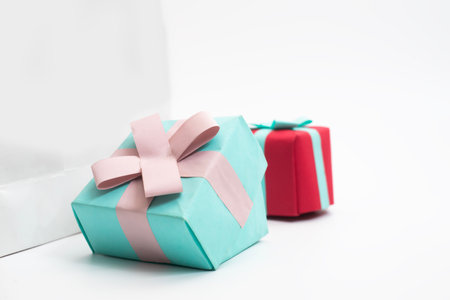 Colorful Two Gift wrapped presents featuring vibrant colors and stylish ribbons. Perfect for...