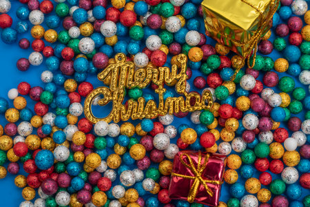 Vibrant Christmas decorations with sparkling balls and wrapped gifts, capturing the festive spirit.の写真素材