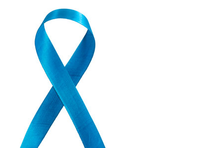 A blue ribbon representing awareness or support, isolated on a white background,の写真素材