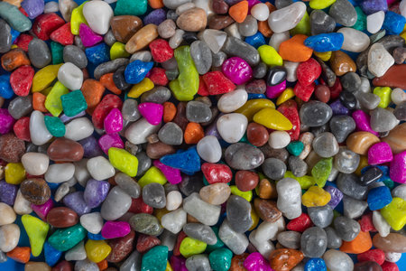 Bright and vivid collection of colorful polished stones and pebbles, showcasing natural texture. Perfect for decoration, crafting, or visual backgrounds.の写真素材