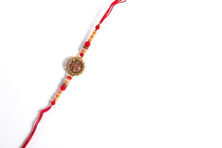 A festive rakhi bracelet featuring vibrant beads and red thread, symbolizing brotherly affection...