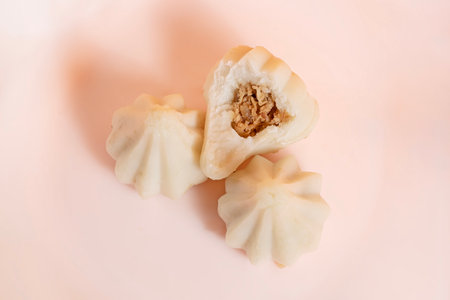 Steamed sweet modak rice dumplings arranged on white background. Perfect for Ganesh Chaturthi...