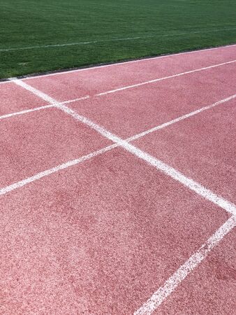 red jogging running stadium