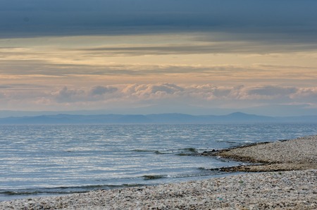 Beautiful sunset above the sea and mountainの写真素材
