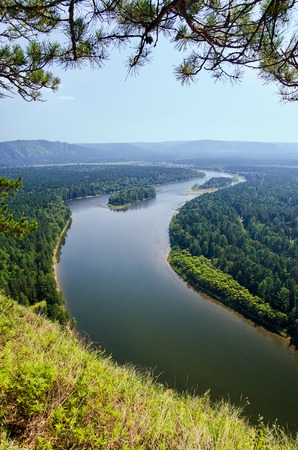 Aerial view of lowland of forest river a summer during a flight.
