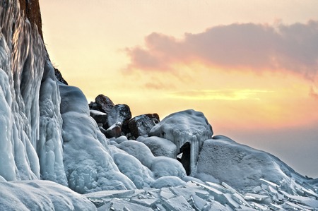Frozen lake and rocks near the ice cave