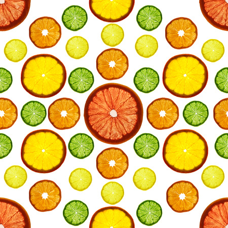 Transparency sliced colorful fruits on white background. Rings of grapefruit, lemon, tangerine and orangeの写真素材