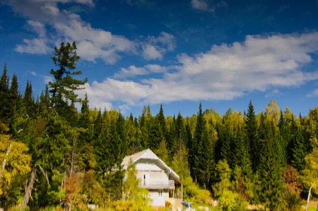 mountain, sky and Vivid orange, yellow and green tones reflect in water on an early morning fall dayの写真素材