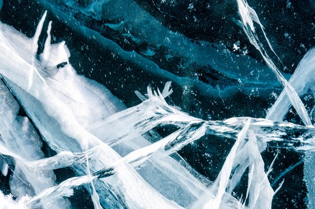 Blue cracked surface of the ice surface