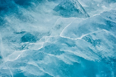 Blue cracked surface of the ice surfaceの写真素材