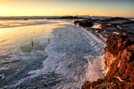 Sunlit mountain range with a sparkling icy texture, and a dreamy, watercolor background of frozen lakeの写真素材