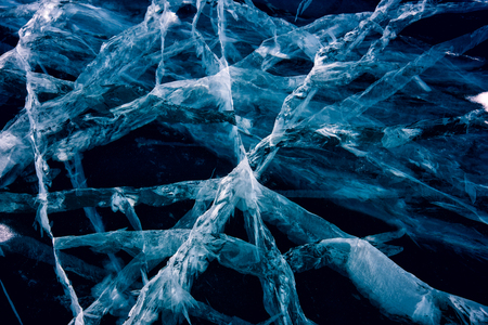 Blue cracked surface of the ice surfaceの写真素材