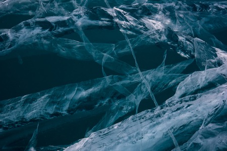 Blue cracked surface of the ice surfaceの写真素材