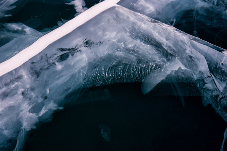 Blue cracked surface of the ice surfaceの写真素材