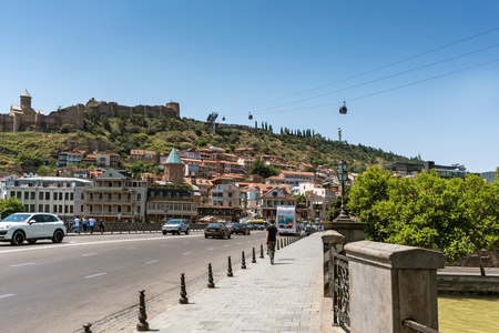Georgia, Tbilisi - July, 3, 2018. Kura river, Narikala castle, funicular and Old Town of Tbilisi....