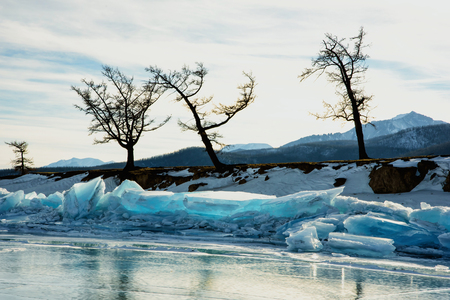 Pure transparent ice hummocks of frozen lake in winterの写真素材