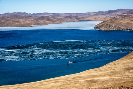 View above big beautiful lake Baikal with Ice floes floating on the water, Russiaの写真素材