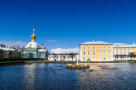 PETERHOF, ST. PETERSBURG, RUSSIA - MAY 4, 2015: East Chapel flanking the central buildings of Grand Peterhof Palace with reflectionのeditorial素材