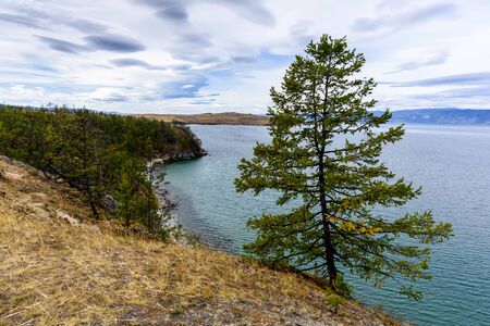 Lake Baikal, tree and mountains of Siberia with beautiful sky and clouds, Russia Oklhon islandの写真素材