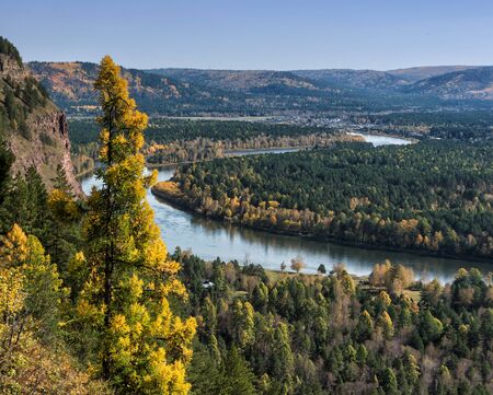 River, rock and autumn forest. View from above.の写真素材
