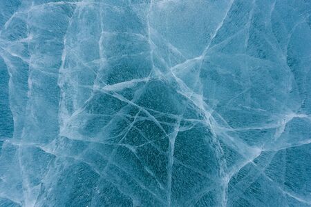 Beautiful ice of Lake Baikal with abstract cracks