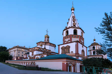 Russia, Irkutsk - June 30, 2020: The Cathedral of the Epiphany of the Lord. Orthodox Church, Catholic Church in sunset with pavingのeditorial素材