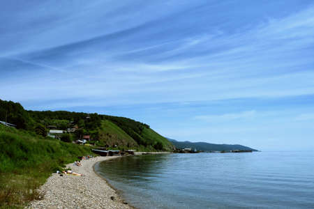 Baikal Lake in summer day. Focus on clear transparent water and coastal stones. Summer travel.の写真素材