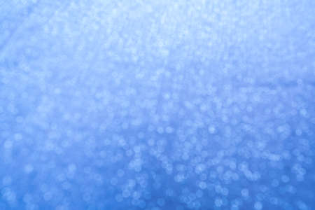 Abstaract light blue defocused background with bokeh.