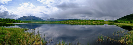 Sunset panorama of small lake in Siberia on background, Buryatia location.の写真素材