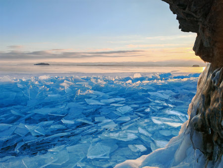 Lake Baikal in winter covered with ice and snow texture in sunset evening, Russia, Siberia