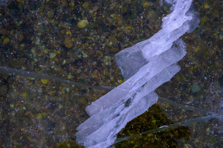Beautiful ice of Lake Baikal with abstract cracks