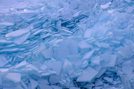 Endless hummock field on frozen Lake Baikal. Piles of snow-covered debris of blue ice on frosty dayの写真素材