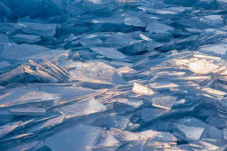 Endless hummock field on frozen Lake Baikal. Piles of snow-covered debris of blue ice on frosty dayの写真素材