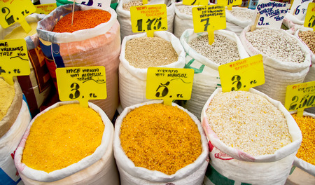 Organic Dry Cracked Corn Kernels, Beans, Lentil, And Wheat In Sacks At A Street Marketのeditorial素材