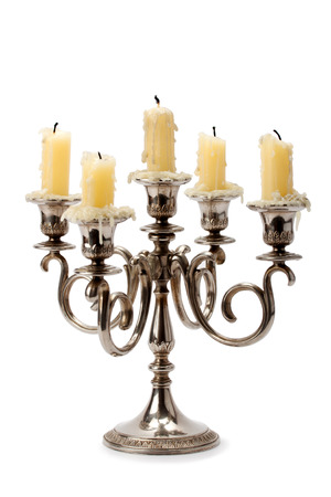 old candlestick with candles isolated on white backgroundの写真素材
