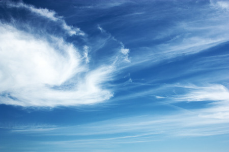 blue sky and white, light clouds closeupの写真素材